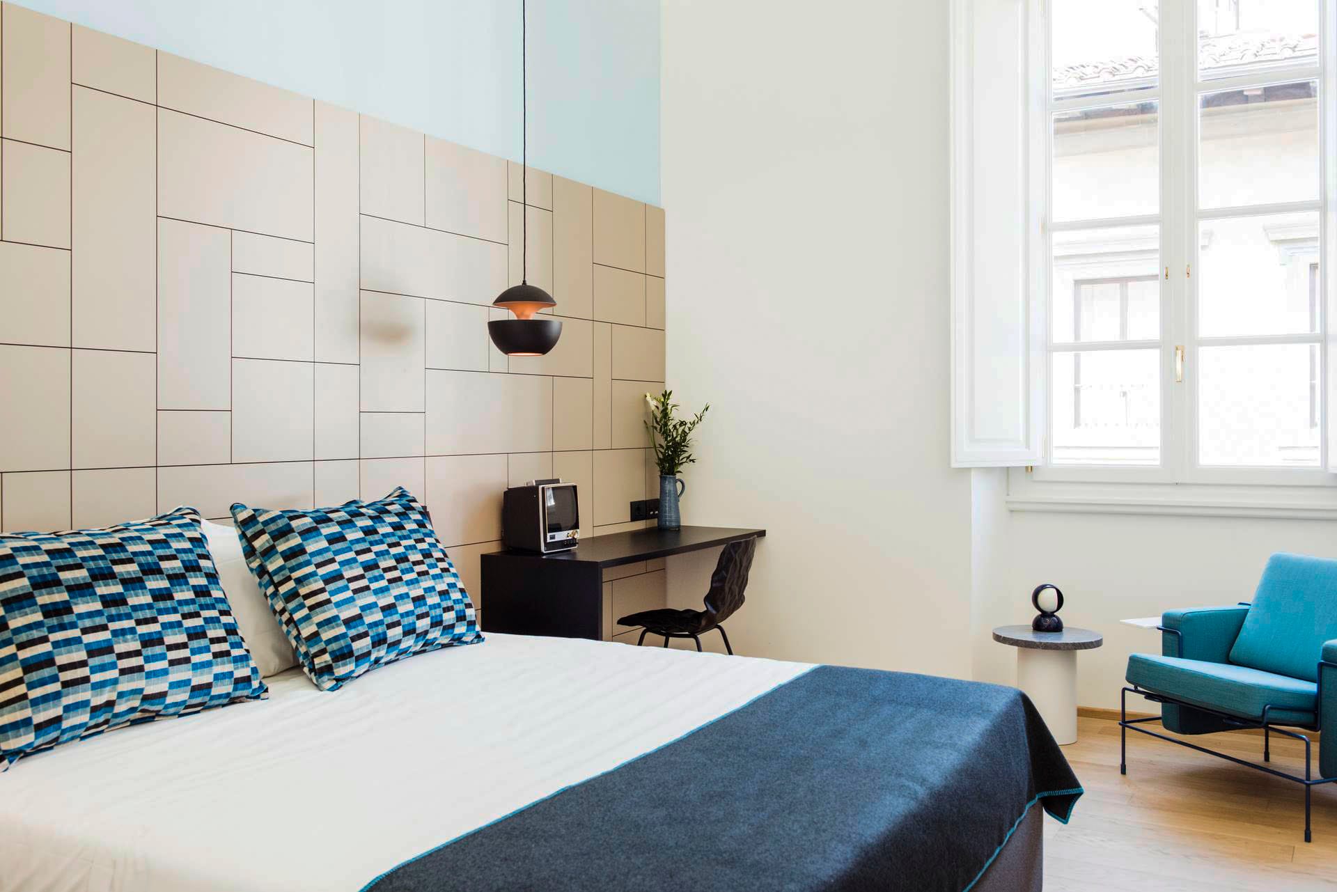 Superior room with double bed and blue bedspread