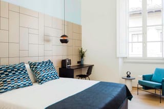 Superior room with double bed and blue bedspread